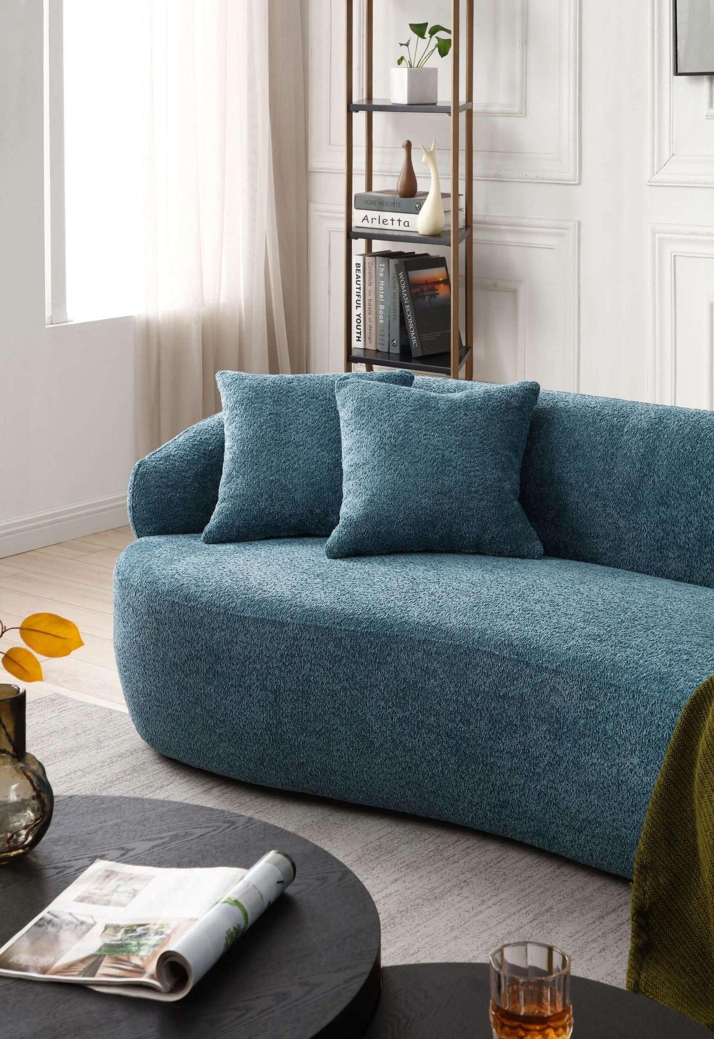 Modern curved boucle fabric 3 seat sofa in blue, featuring thickened seat and backrest for optimal relaxation in a sophisticated living room.