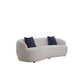 Modern curved boucle fabric 3 seat sofa 86" in white with dark blue pillows, featuring a sleek and inviting silhouette.