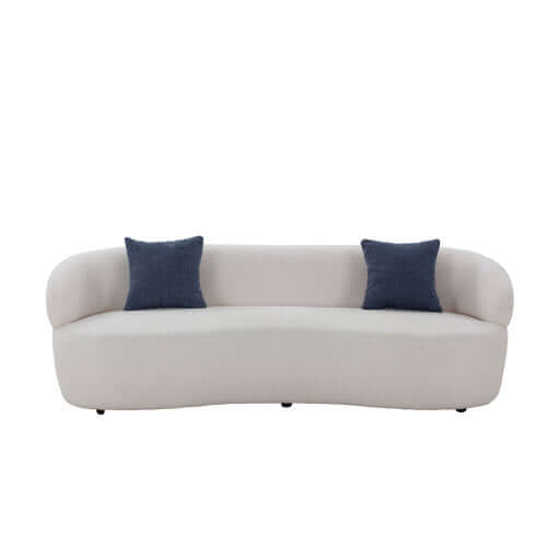 Modern curved boucle fabric 3 seat sofa in white with blue cushions, showcasing a sleek and sophisticated design for optimal relaxation.