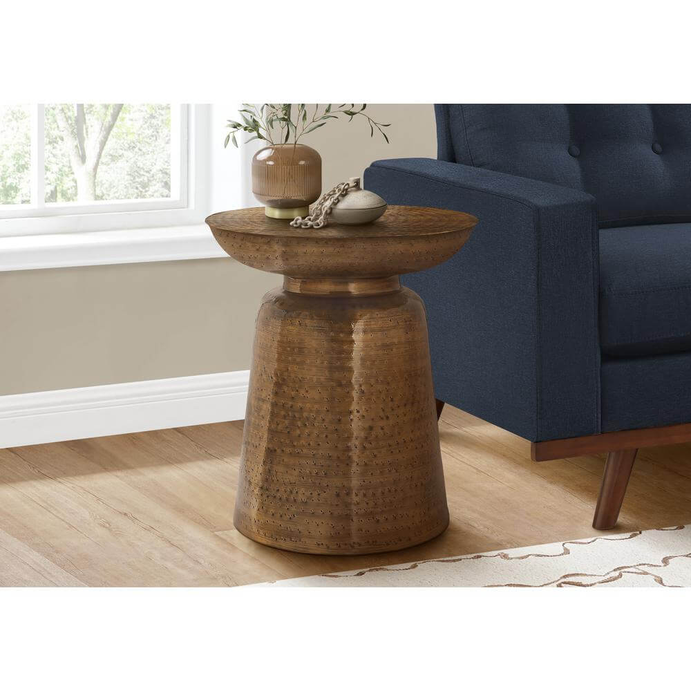 Hammered Metal Round Drum Accent End Table in a Living Room Setting.