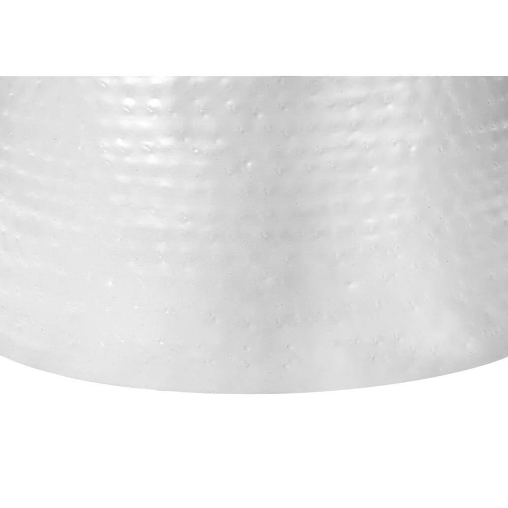 Close-up of hammered white metal pattern on round drum accent end table