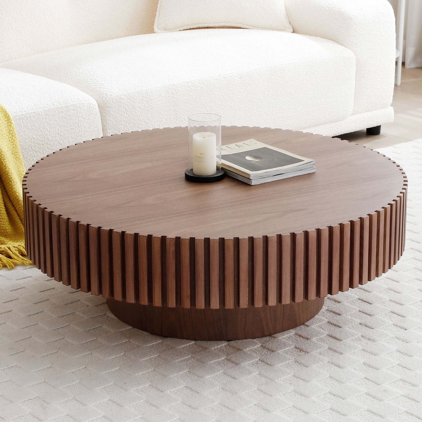 Round MDF wood coffee table with sturdy pedestal base in living room setting, featuring minimalist decor and compact 39" diameter design