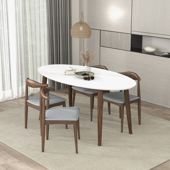 Ada MCM solid wood oval top dining table with chairs in a modern dining room