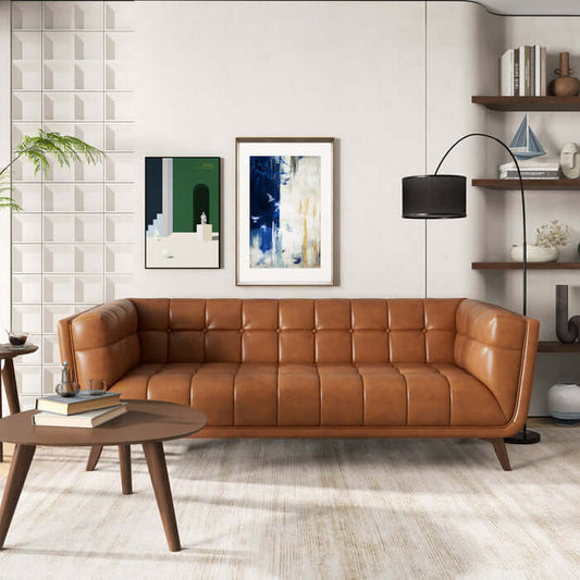 Mid-Century Modern Addison tan leather tufted sofa in stylish living room with art and decor