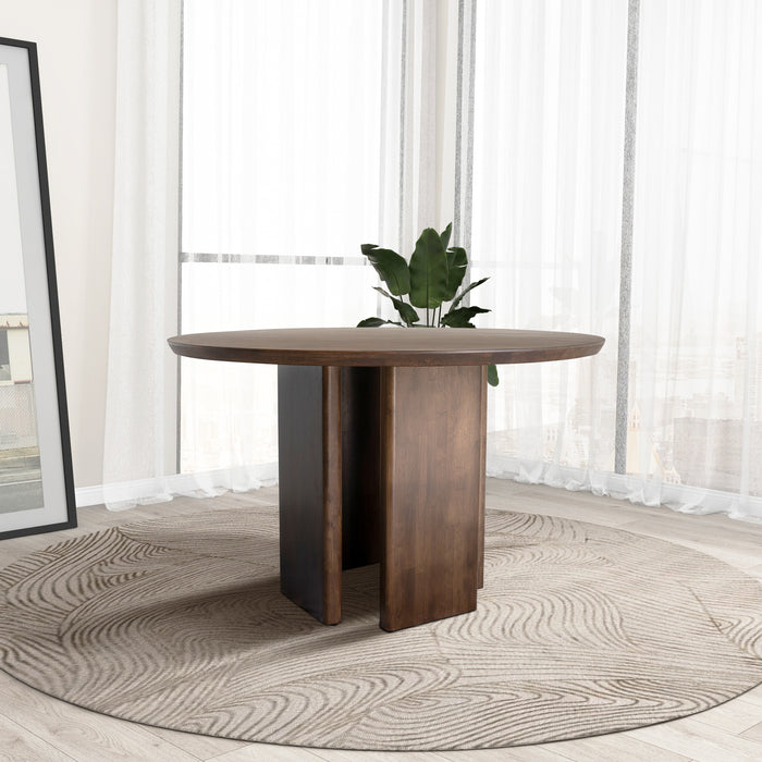 Alden Round Solid Walnut Wood Dining Table 47" with pedestal base in modern dining room setting.