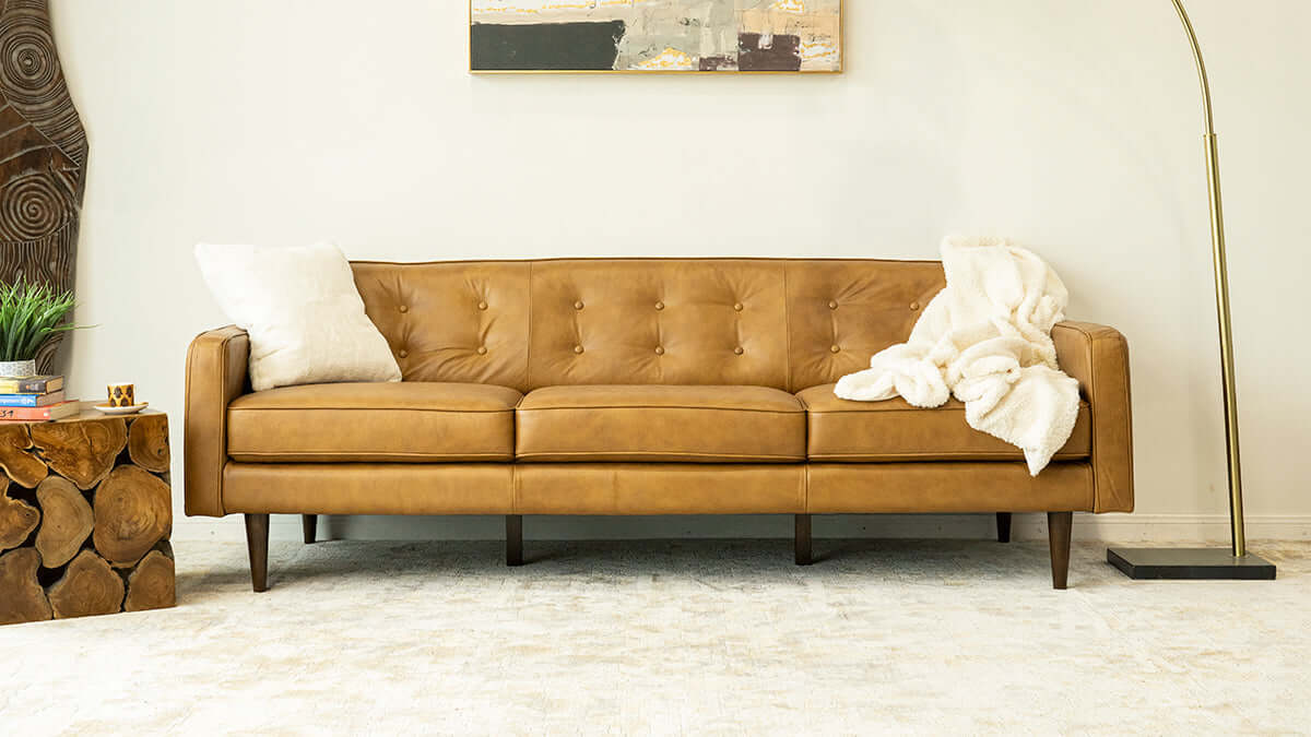 Braxton MCM Tan Genuine Leather Button Tufted Sofa (88") in mid-century modern living room setup.