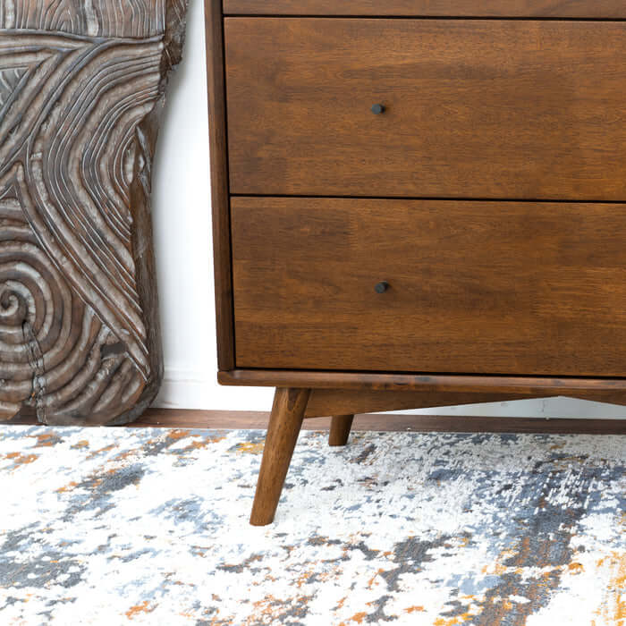 Caroline MCM Solid Wood 3-Drawer Dresser in mid-century modern style, shown with tribal art and rug in bedroom decor.