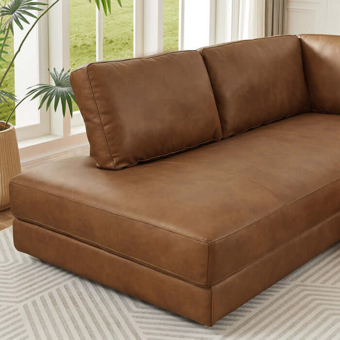 Close-up of Glander Modern Leather Sectional Chaise Sofa 108" in a stylish living room with soft, luxurious brown leather upholstery