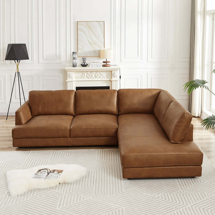 Glander Modern Leather Sectional Chaise Sofa 108" in stylish living room setting with elegant decor and soft lighting.