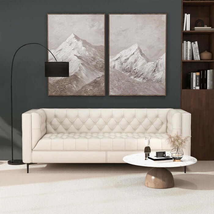 Evelyn MCM Tufted Tan Leather Luxury Chesterfield Sofa in elegant living room with mountain artwork and modern decor.