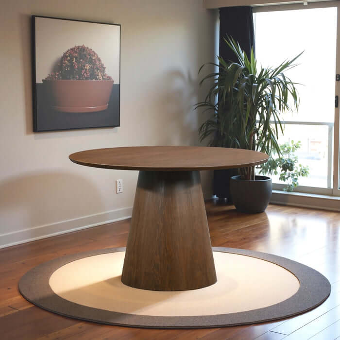 Palamedes Solid Wood Round Table in Walnut with cone-shaped base in modern dining space.