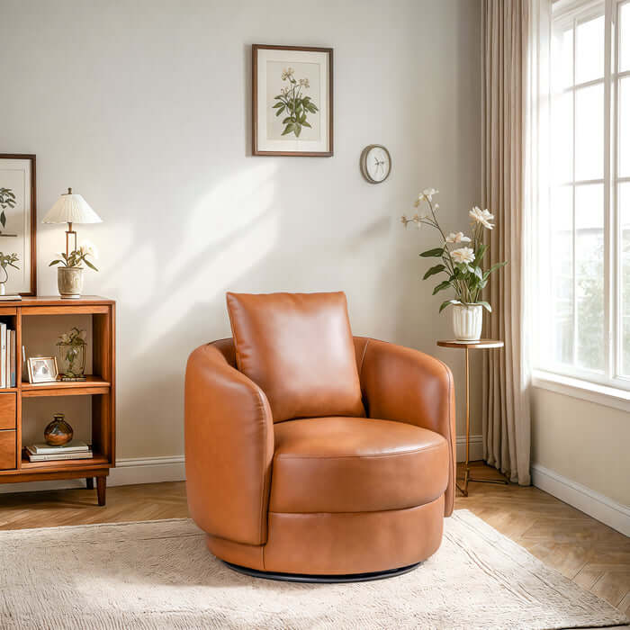 Dylan Cognac Faux Leather Swivel Chair in a modern living room with natural light and plants.