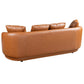 Back view of Dylan Modern Cognac Faux Leather Sofa showcasing elegant curves and plush cushions. Perfect for stylish living rooms.