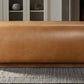 Close-up of Kelvin Vegan Tan Leather Bench showcasing its sleek design and rich texture on a modern rug.