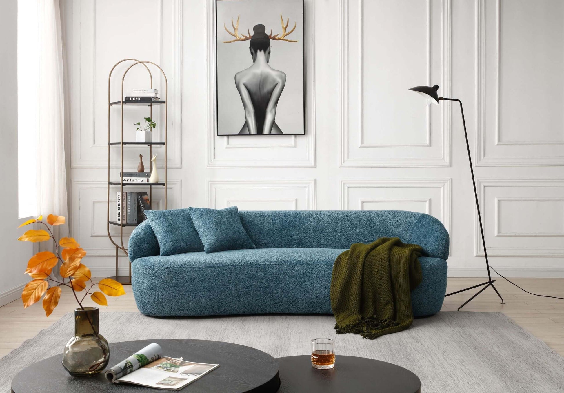 Modern Curved Boucle 3 Seat Sofa in Blue in a stylish living room with wall art, tall lamp, and cozy decor.